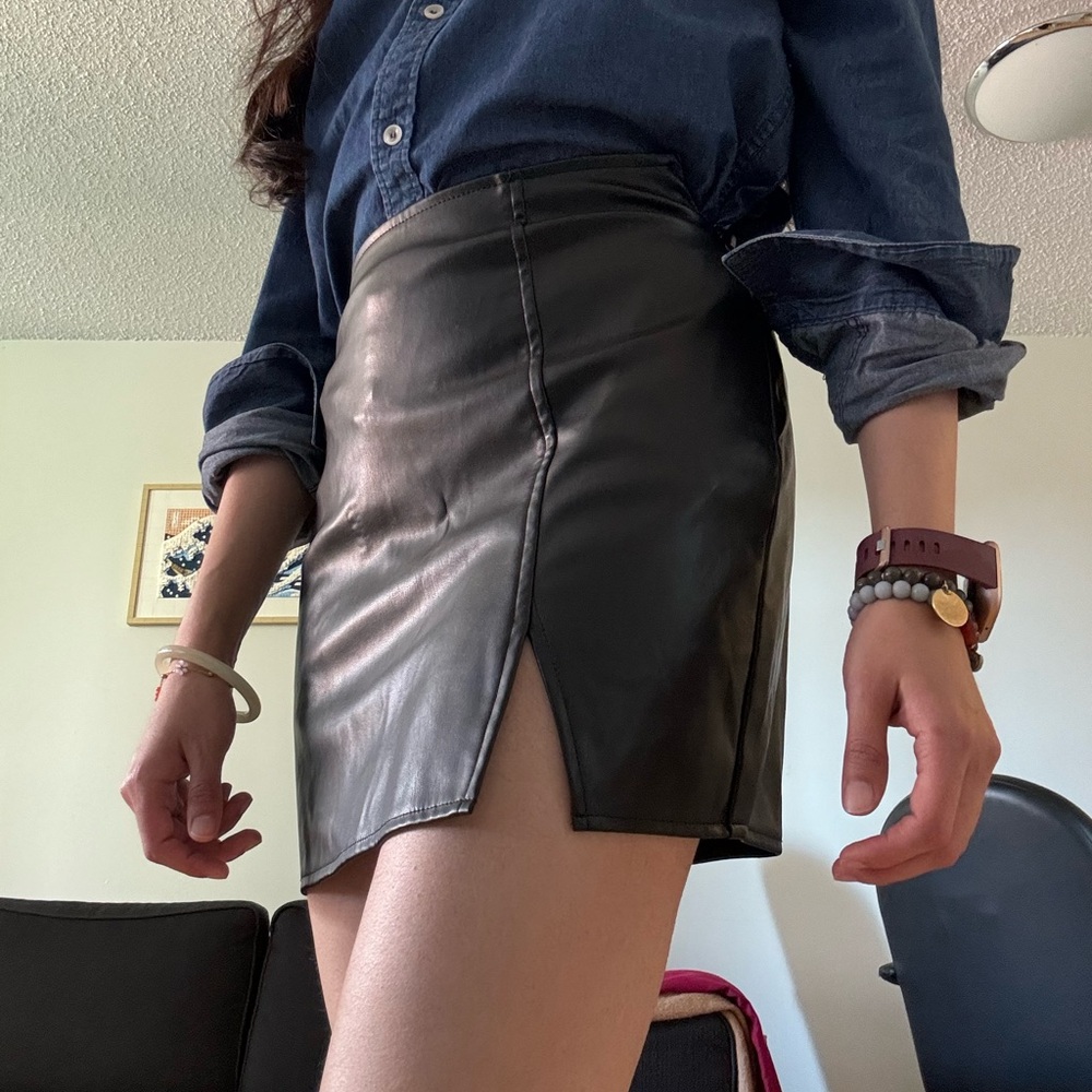 Black faux leather mini skirt with slit size 2
